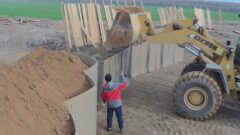 Filling the JOESCO military barrier with an excavator thumbnail