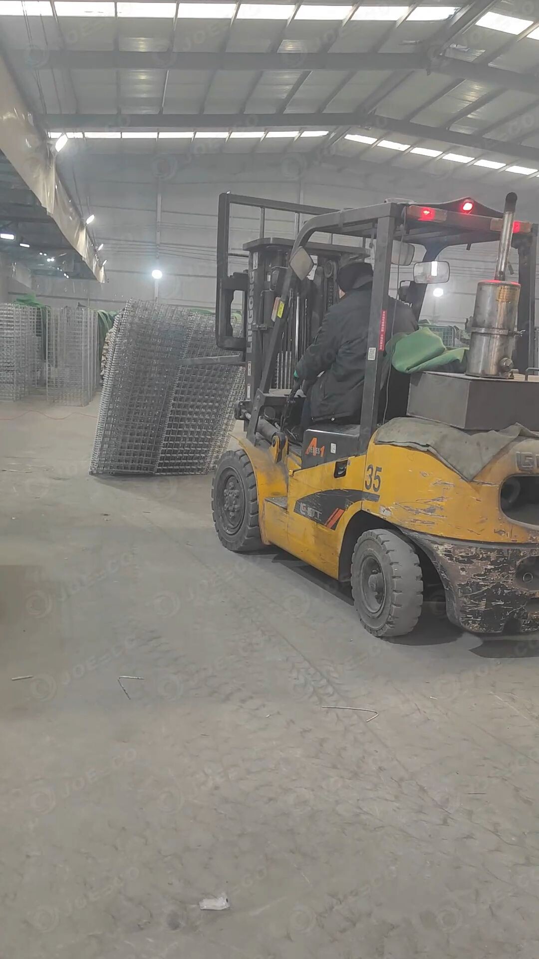How to use a forklift to stand up an military barrier. thumbnail 1