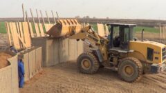 Using a forklift can fill two military barrier units at once thumbnail